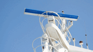 Commercial marine radar antenna. The rotating antenna radiates a vertical fan-shaped beam.